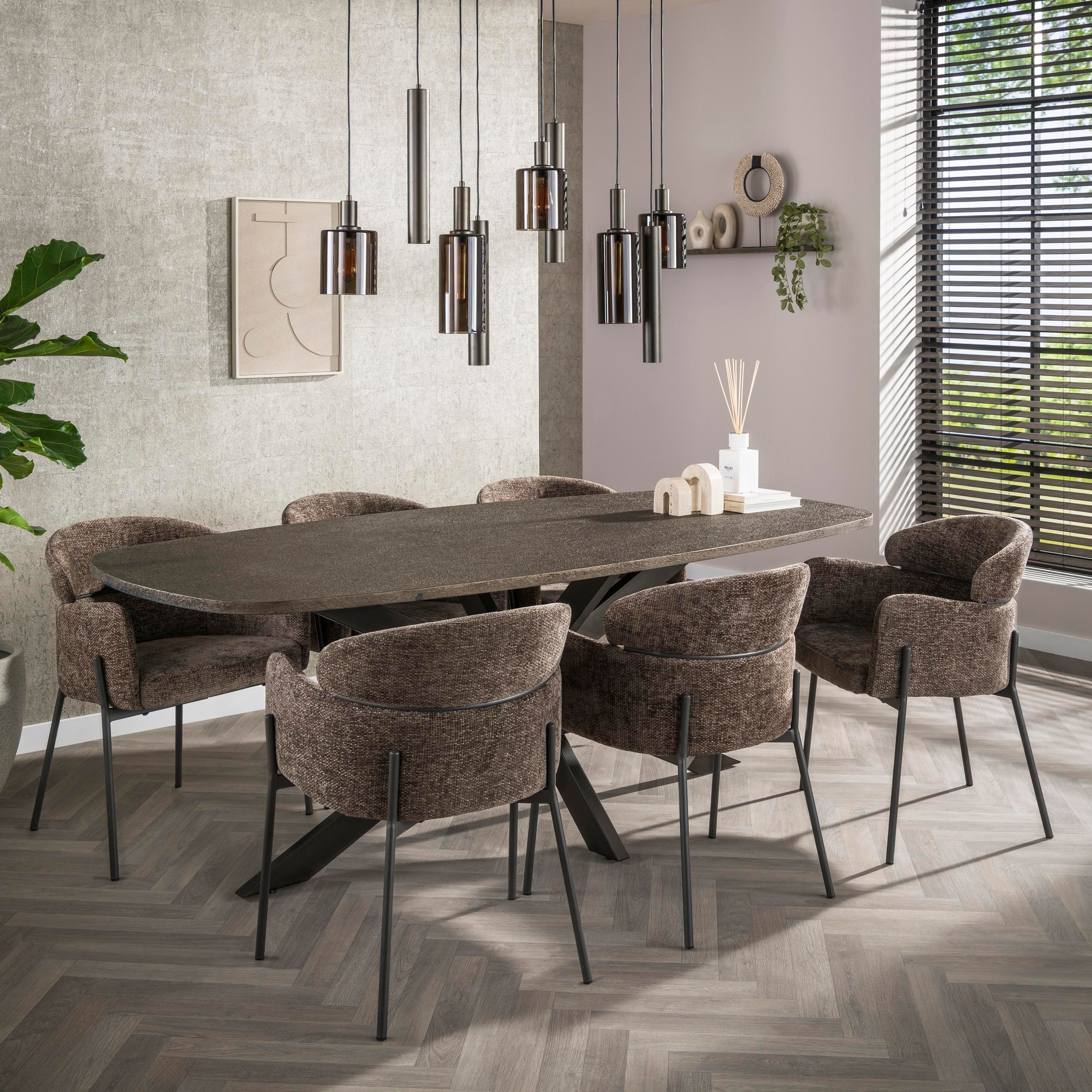 Dining room with a long dark gray table and six matching chairs, featuring modern pendant lights and a neutral color scheme.